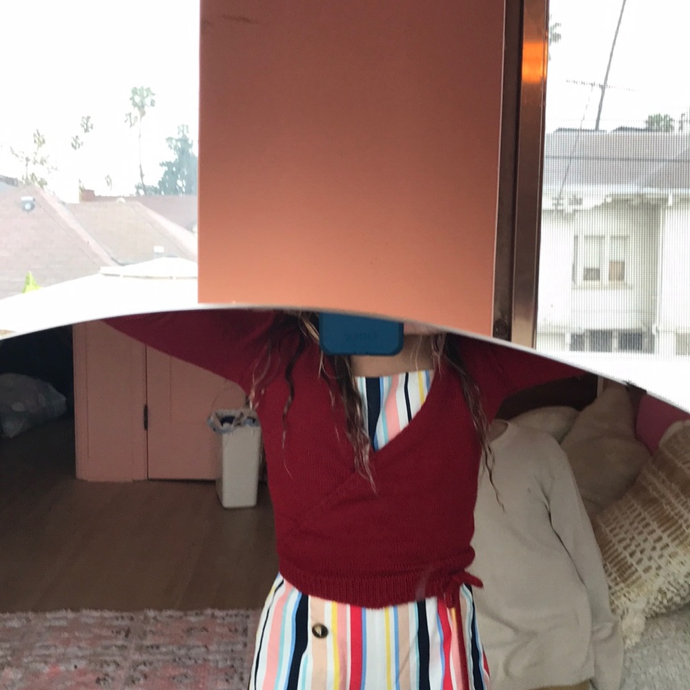 Red ballet or gymnastics small sweater cover up.